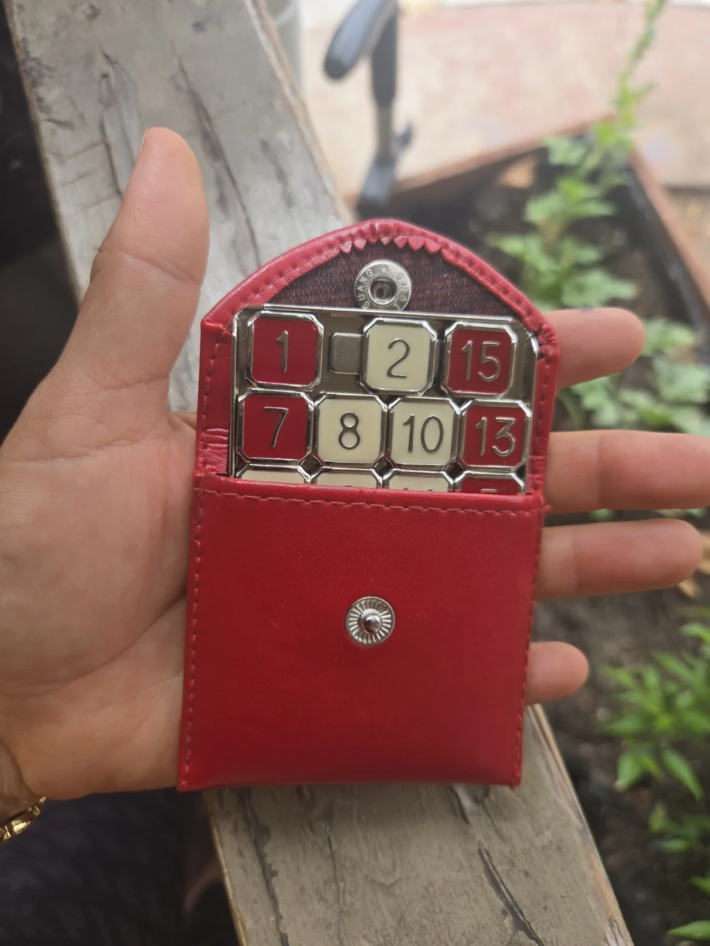 Eddie Bauer Red and Cream Metal Fifteen Puzzle with Red Leather Pouch